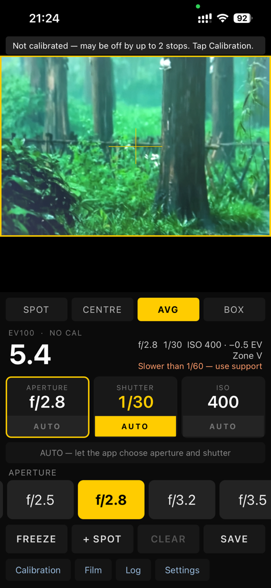 The metering screen: a live 3:2 preview with a yellow region marker, EV 5.4, and tiles for aperture, shutter and ISO.